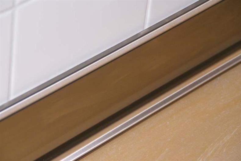 Polyester concrete skirting board with stainless steel cladding H=100 mm L=1m